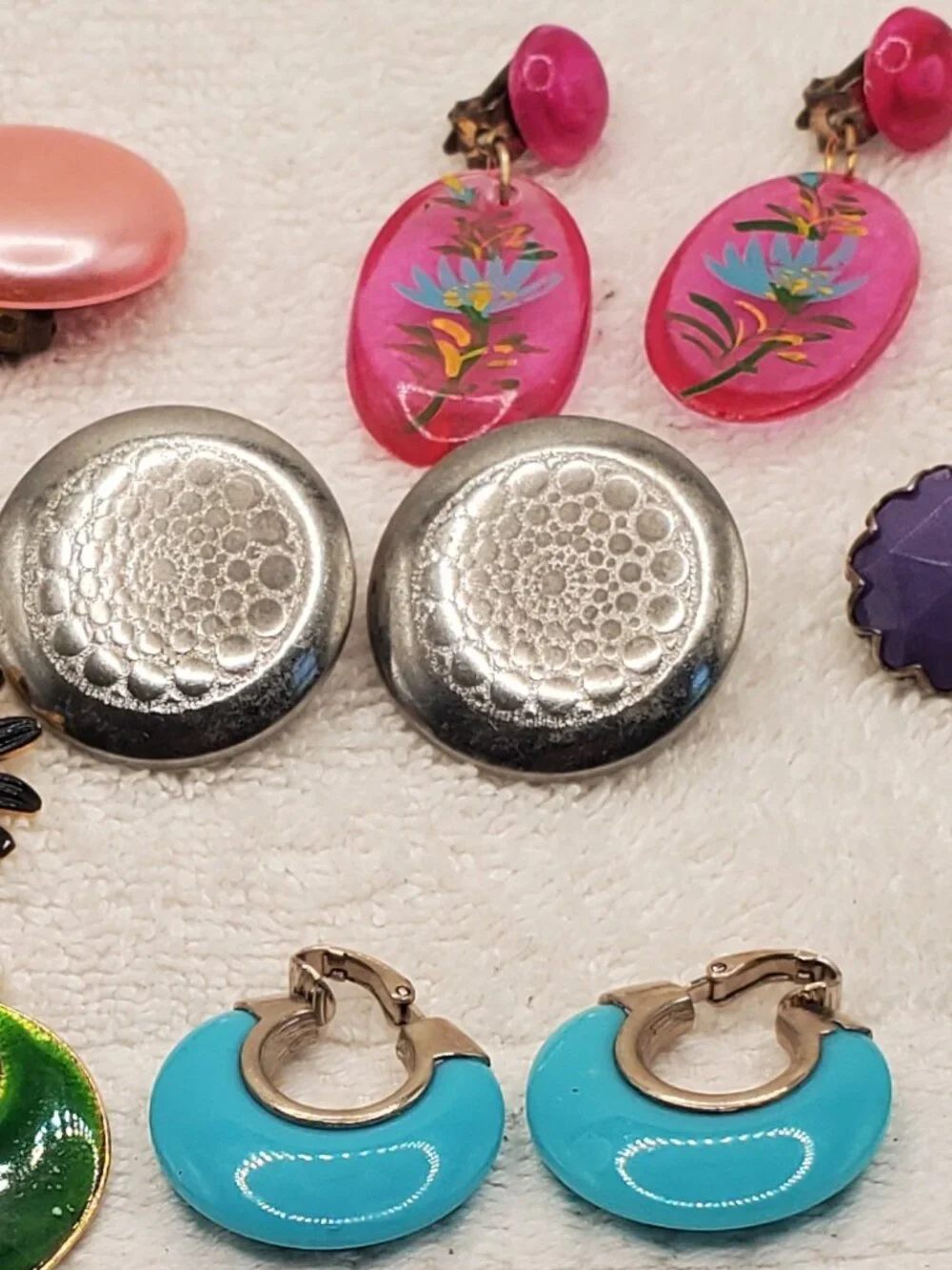 12 Pair of clip on earrings, items # B-2106-2117,.  wt. 123 grams.